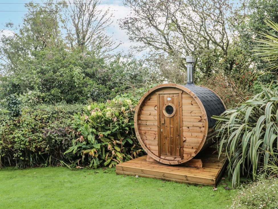 A wooden sauna in the garden at Glenside House, Carbis Bay