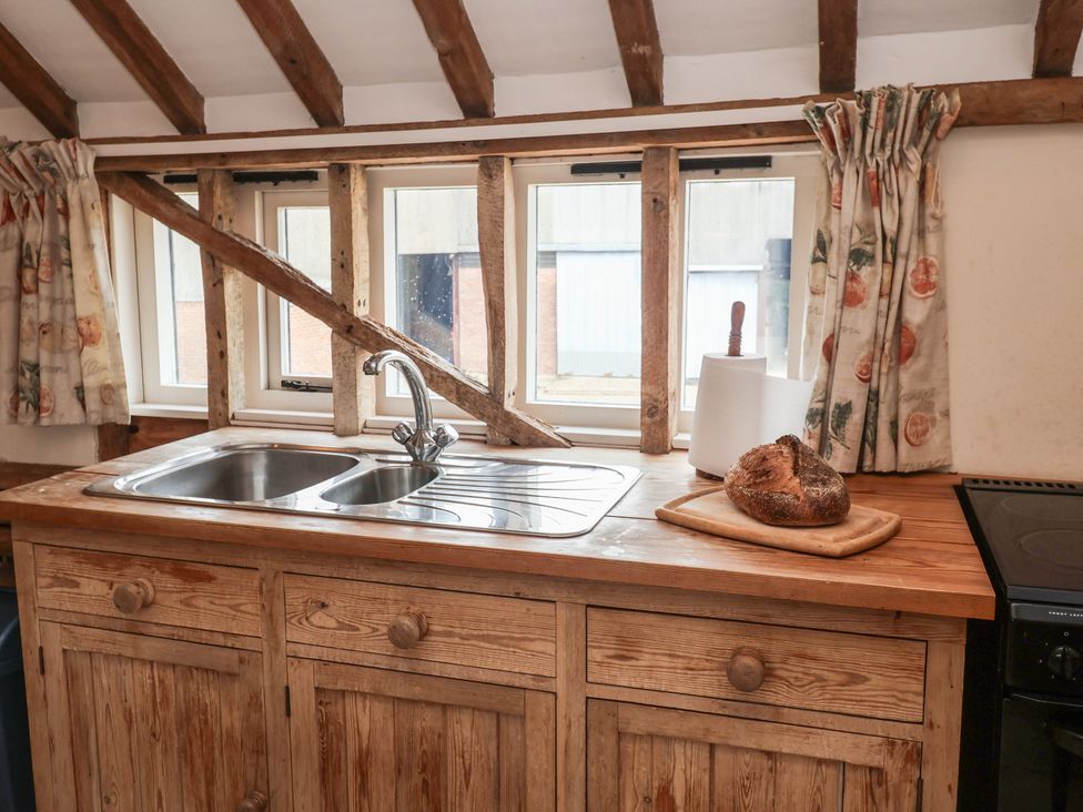 A kitchen with a sink and countertop at The Cow Shed in Chediston near Halesworth