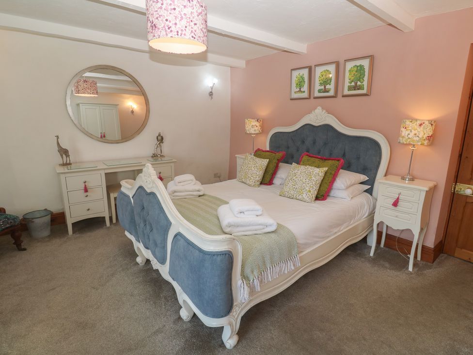 A bedroom with a bed and furniture at Riviere House Hayle
