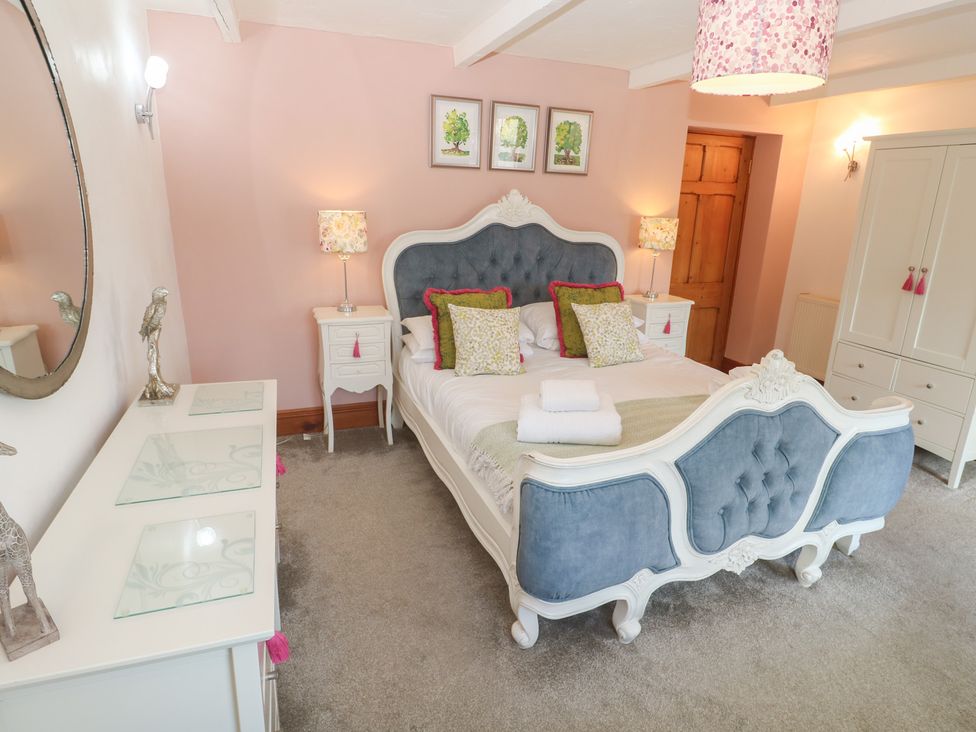 A bedroom with a bed and bedside table at Riviere House in Hayle