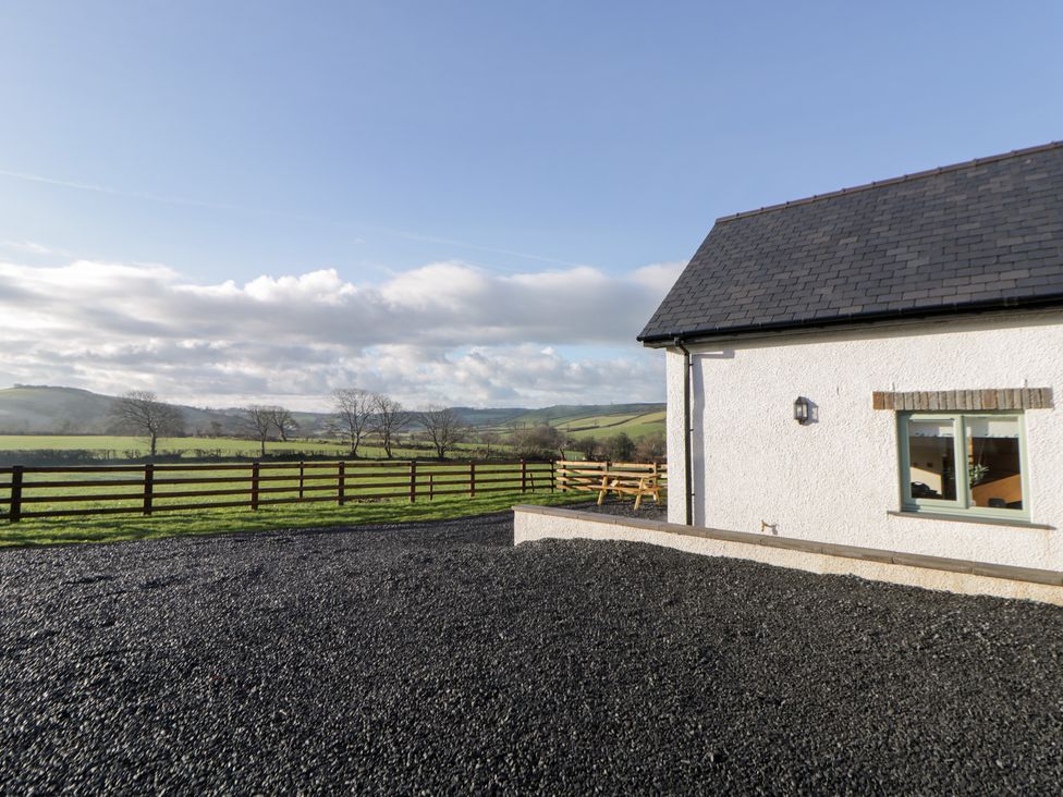 An outdoor area with a house and views of hills at Y Stabal near Llanilar