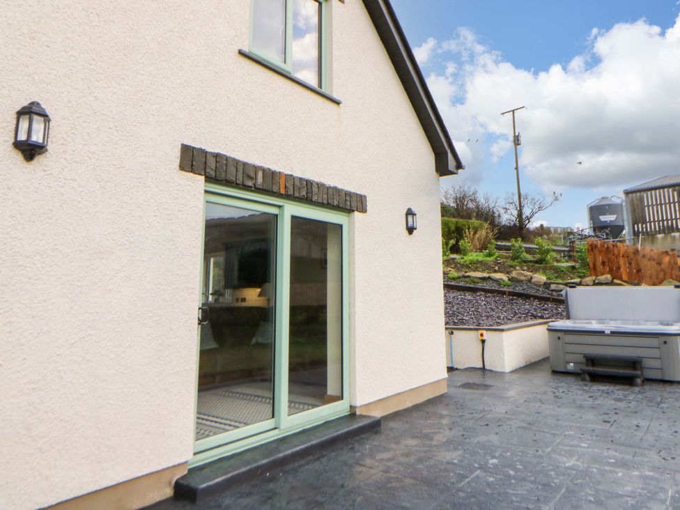 An outdoor area with a door and window at Y Beudy near Llanilar