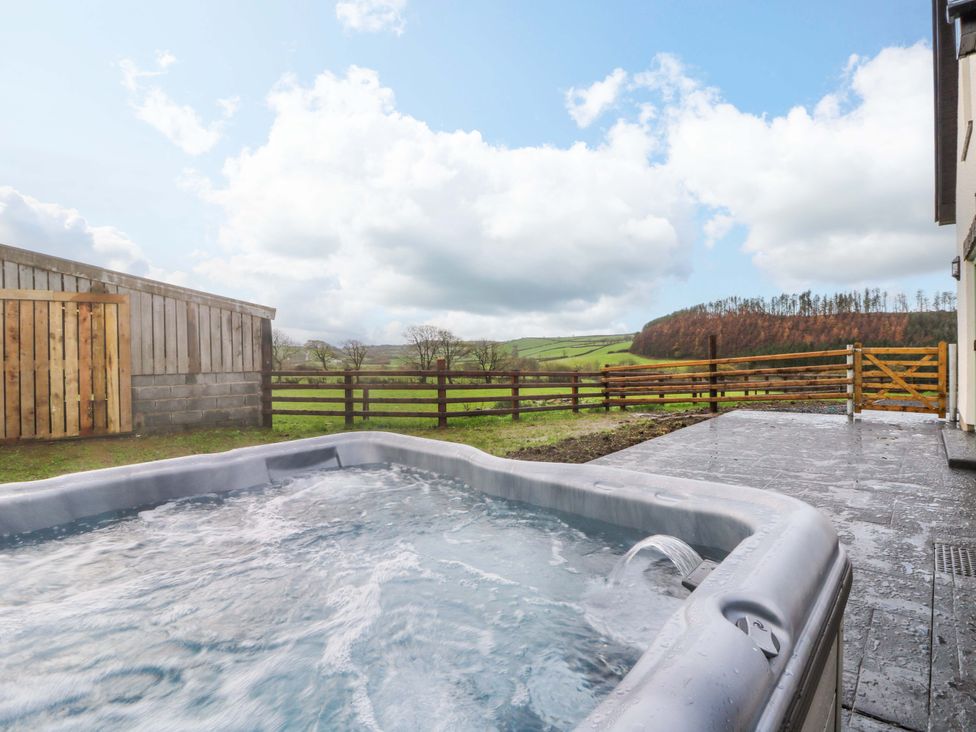 A hot tub in an outdoor space at Y Beudy near Llanilar