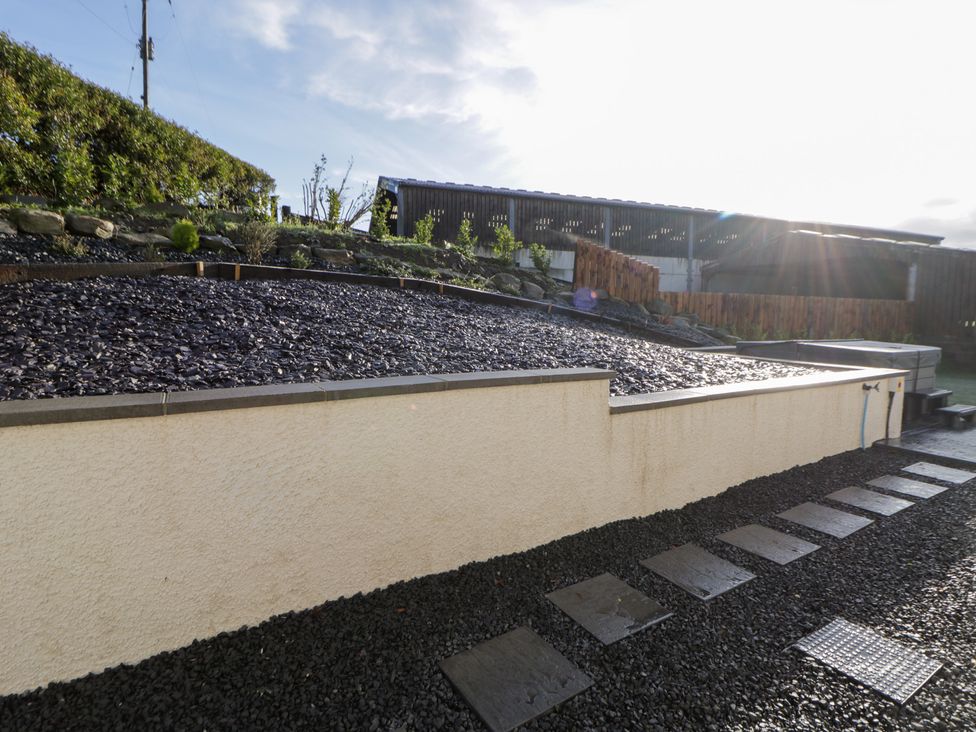 A garden with gravel and landscaped stones at Beudy near Llanilar