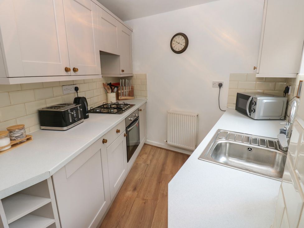 A kitchen with countertop appliances and a sink at 1 Eden Cottages in Corby Hill