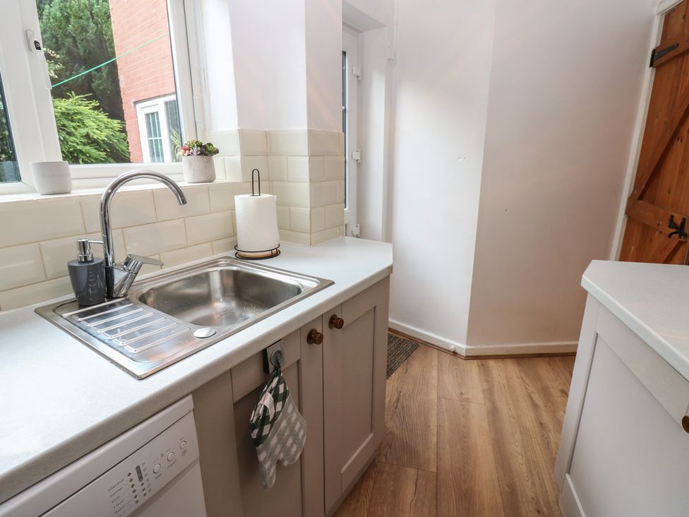 A kitchen with a sink and dishwasher at 1 Eden Cottages in Corby Hill