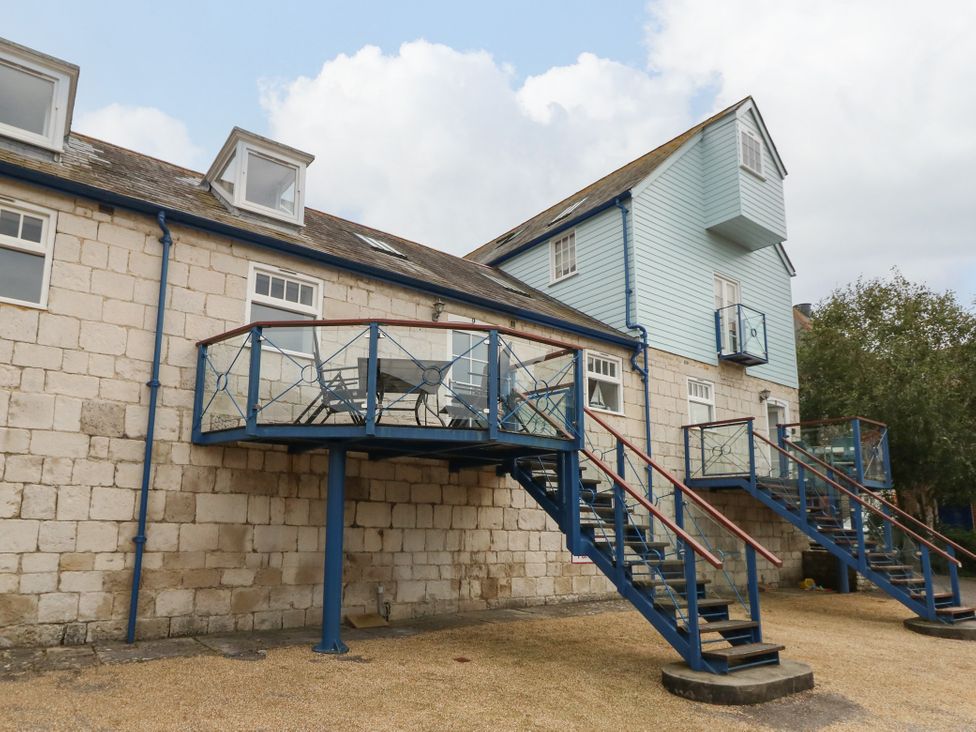 A building with balconies and stairs at Spindrift in Brewers Quay Harbour