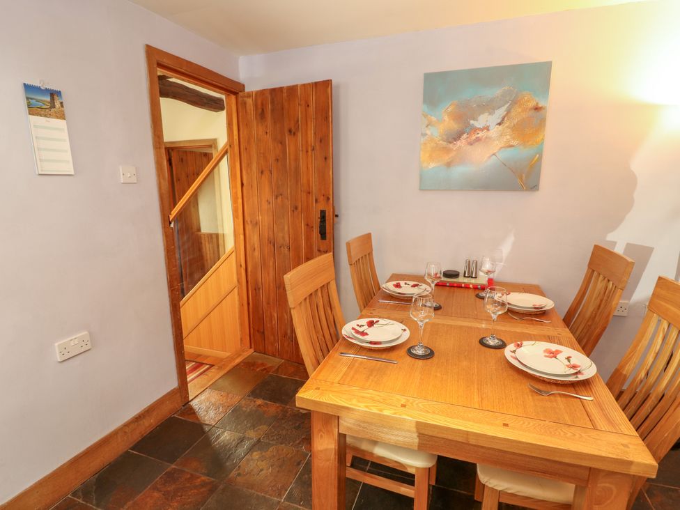 A dining room with a table set for dinner at Beck Edge in Braithwaite