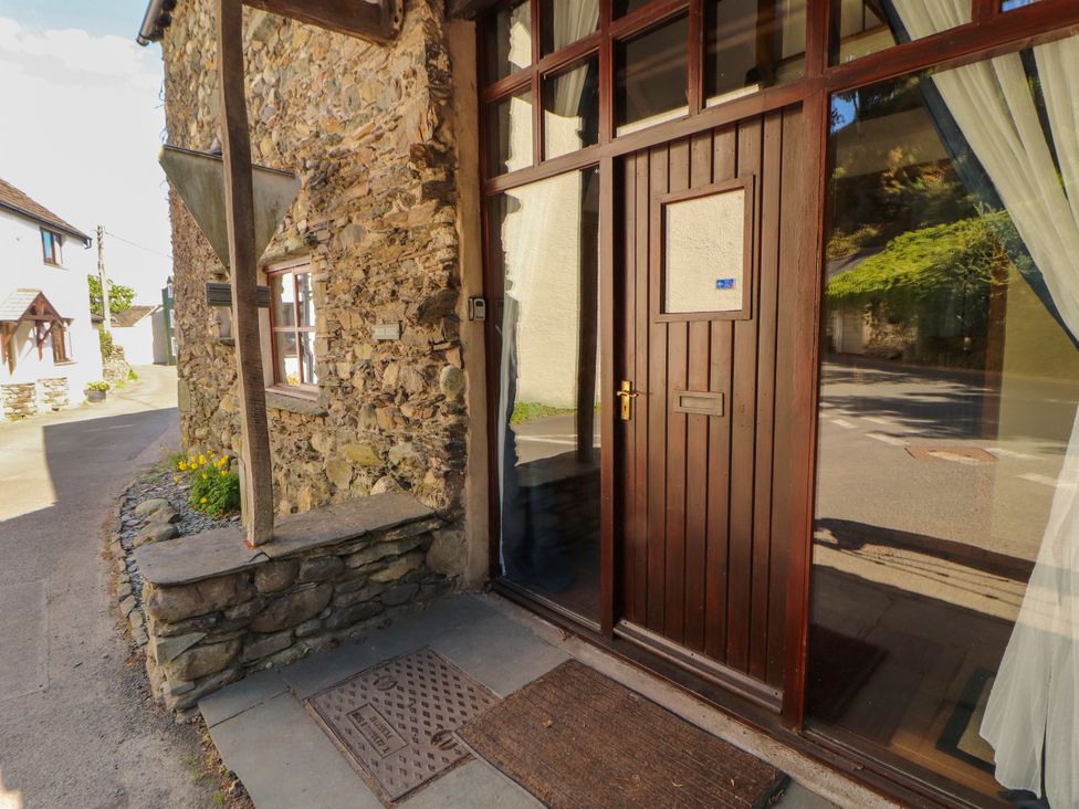 An entrance with a door and a doormat at Beck Edge in Braithwaite
