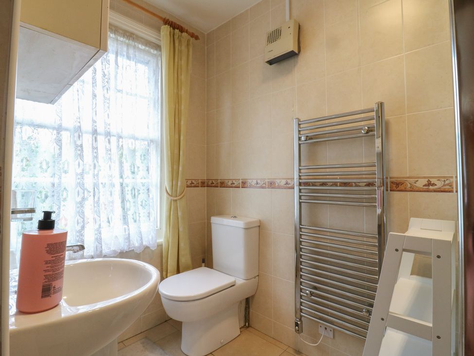 A bathroom with a sink and toilet at Chilton Manor House in Sittingbourne