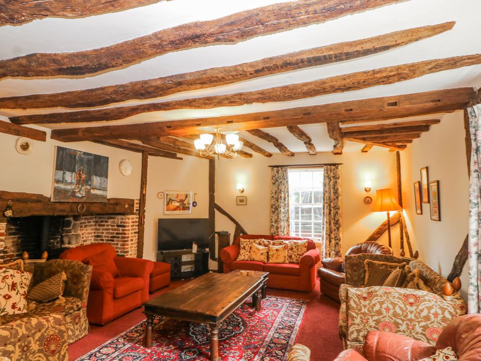 A living room with sofas and a coffee table at Chilton Manor House in Sittingbourne