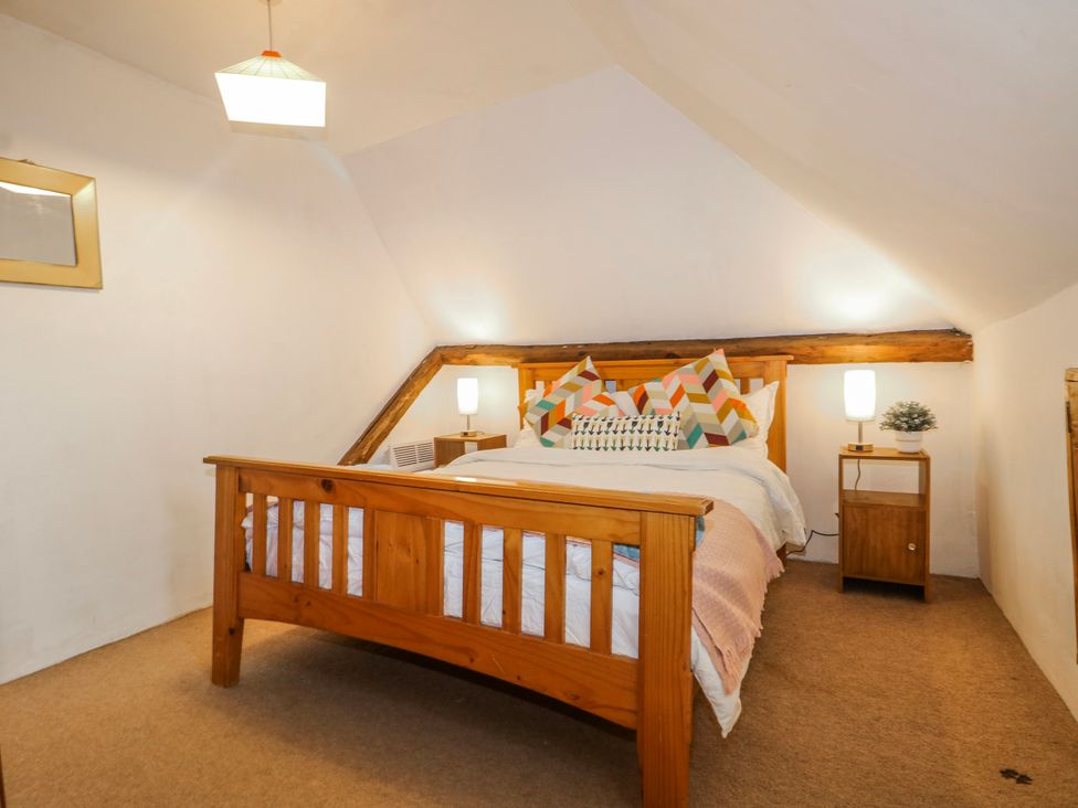 A bedroom with a bed and pillows at Chilton Manor House in Sittingbourne