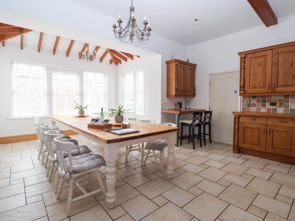 A kitchen with table and chairs at The Grange in Flamborough