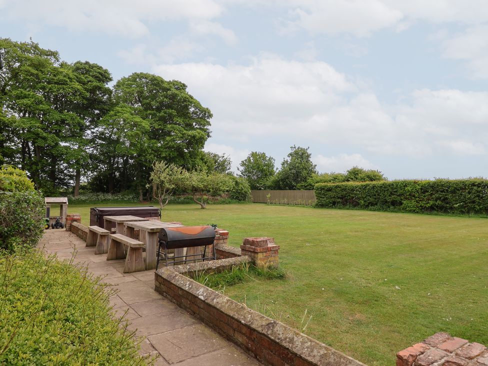 A garden with tables and chairs at The Grange in Flamborough