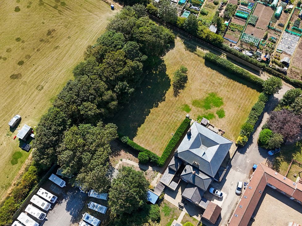 An aerial view of a garden and building at The Grange in Flamborough