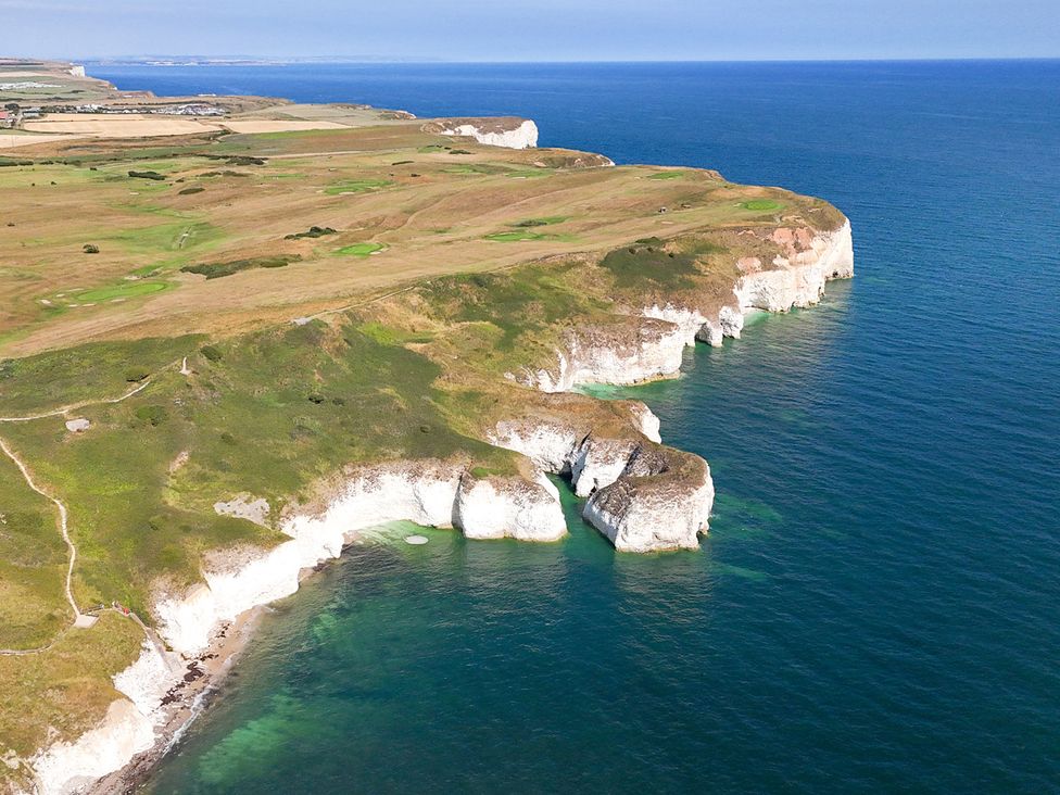 A coastal view with cliffs and grassland at The Grange in Flamborough