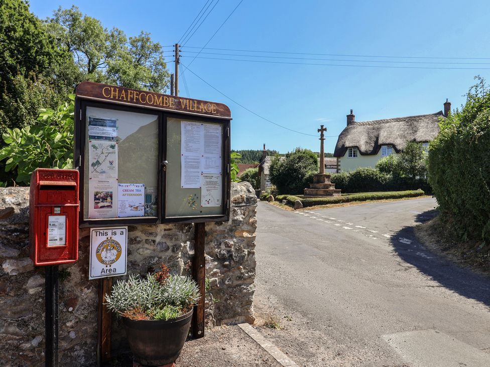 An information board and postbox at Chaffcombe Village in Chard