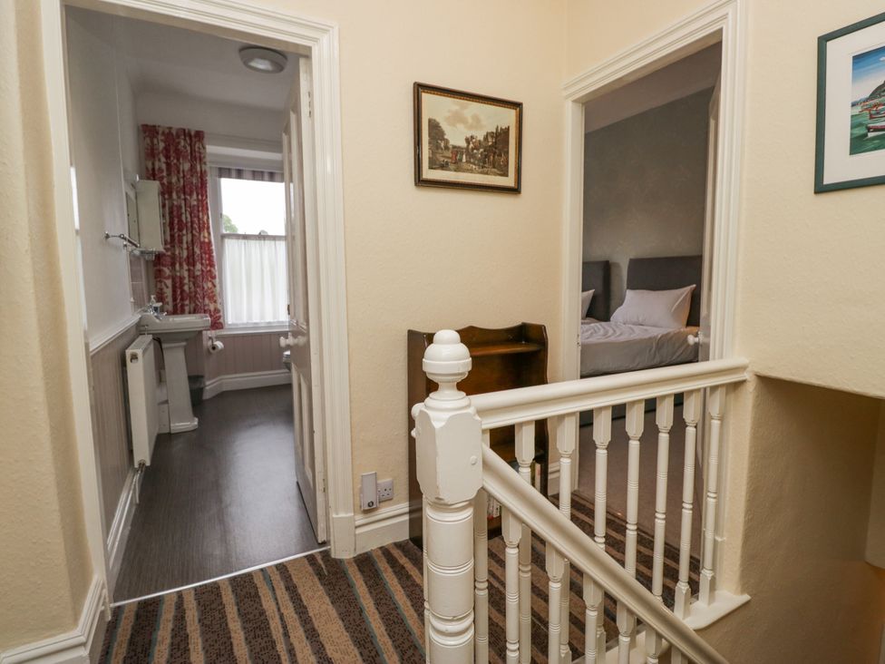 A hallway with doors to a bathroom and a bedroom at 14 Castle Garth Kendal