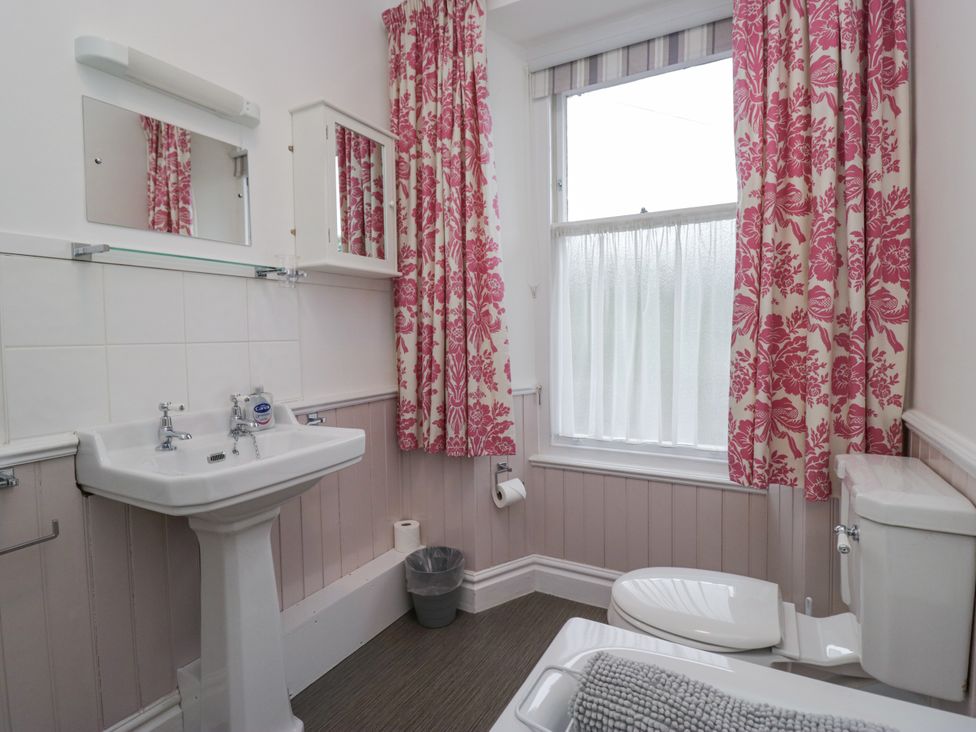 A bathroom with a sink and toilet at 14 Castle Garth in Kendal
