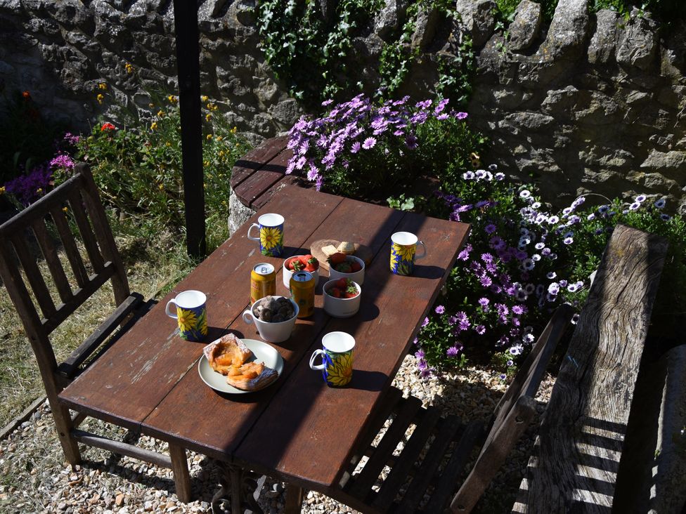 A garden table with food and drinks at 33 High Street Fortuneswell