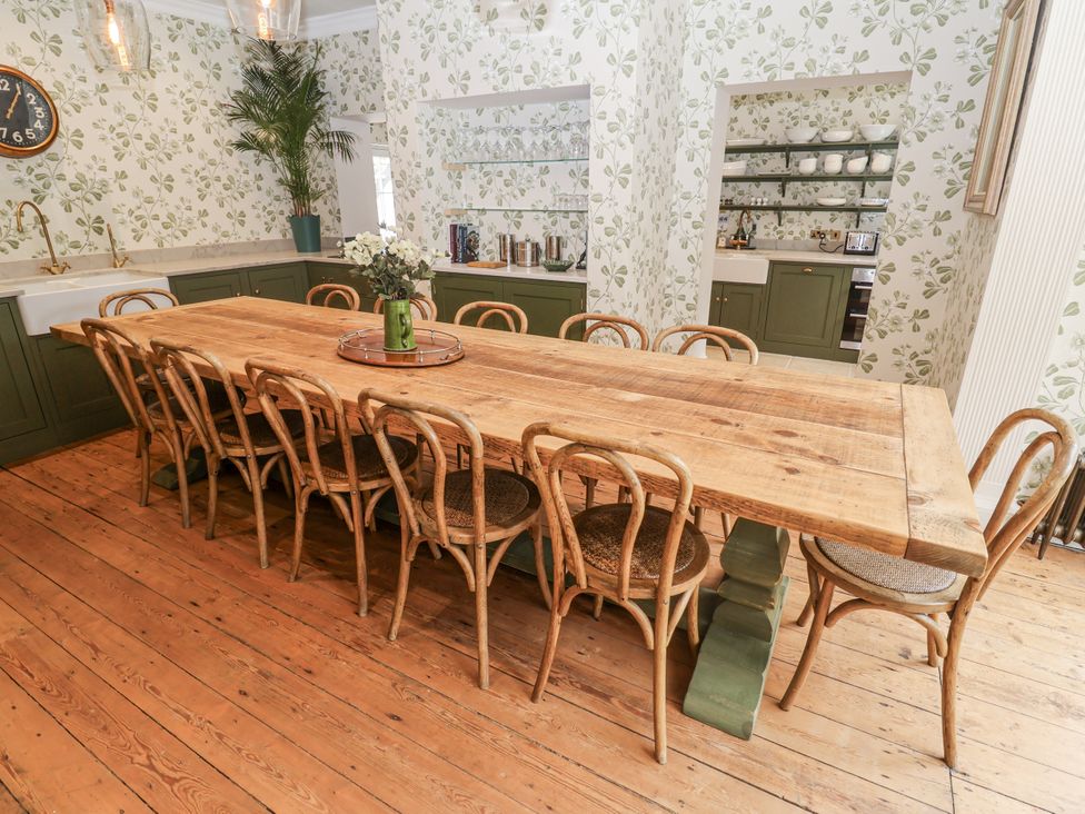 A dining room with a large table and chairs at Syleham House Syleham near Eye