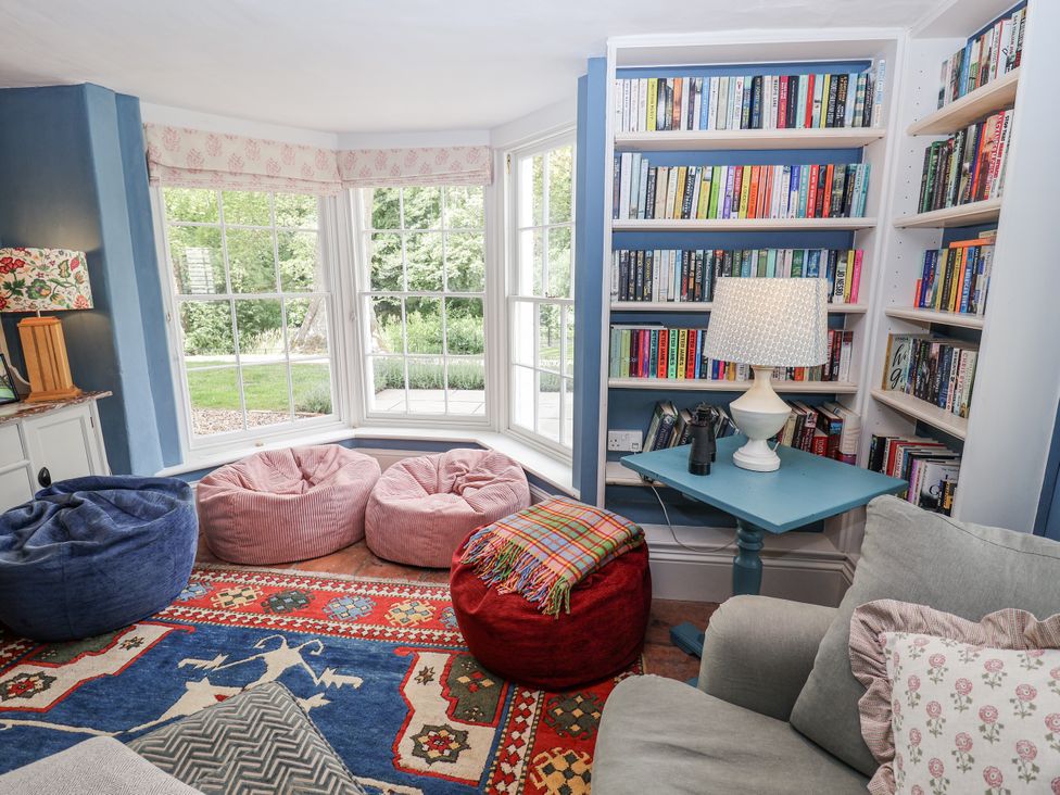 A snug with bean bags and bookshelf at Syleham House Syleham near Eye