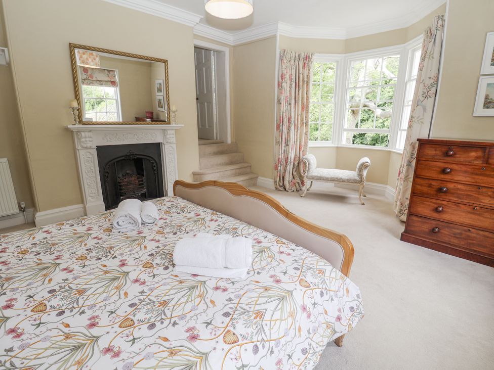 A bedroom with a bed and a chest of drawers at Syleham House Syleham near Eye