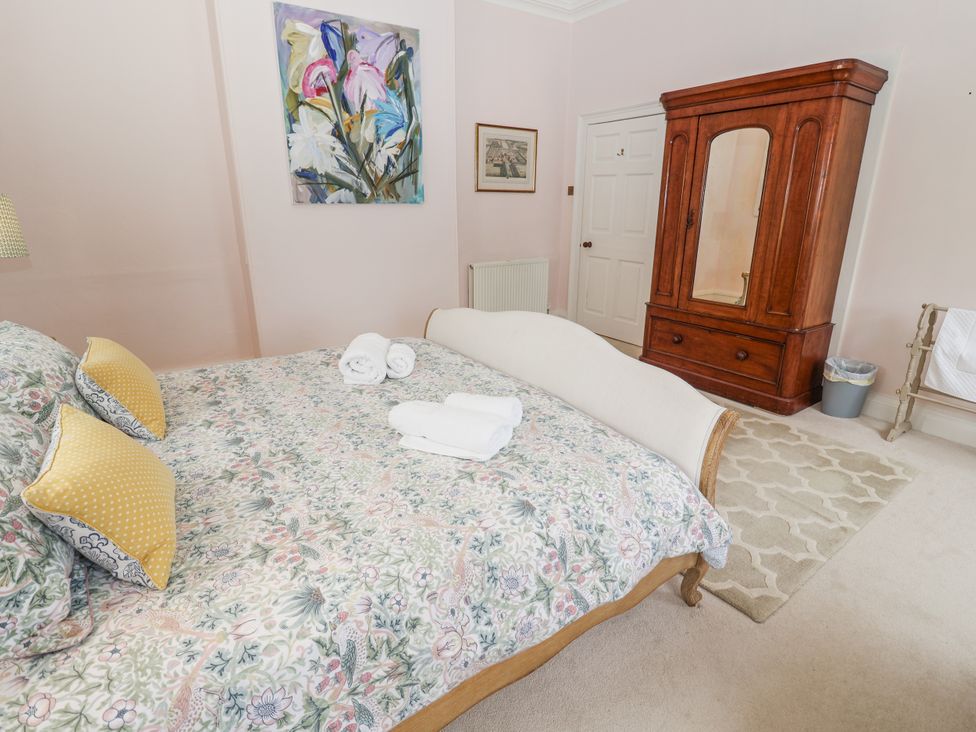 A bedroom with a bed and wardrobe at Syleham House Syleham near Eye
