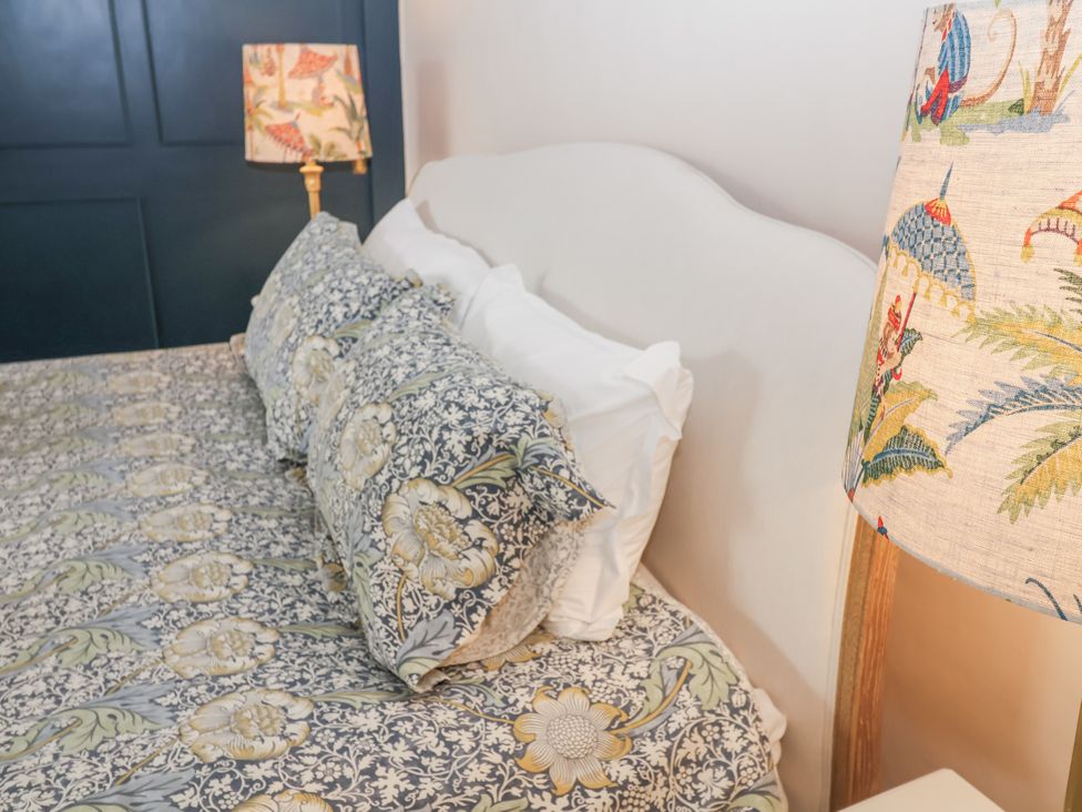 A bedroom with a bed and pillows at Syleham House in Syleham near Eye