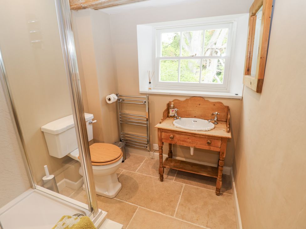 A bathroom with a shower, toilet, and sink at Syleham House in Syleham near Eye