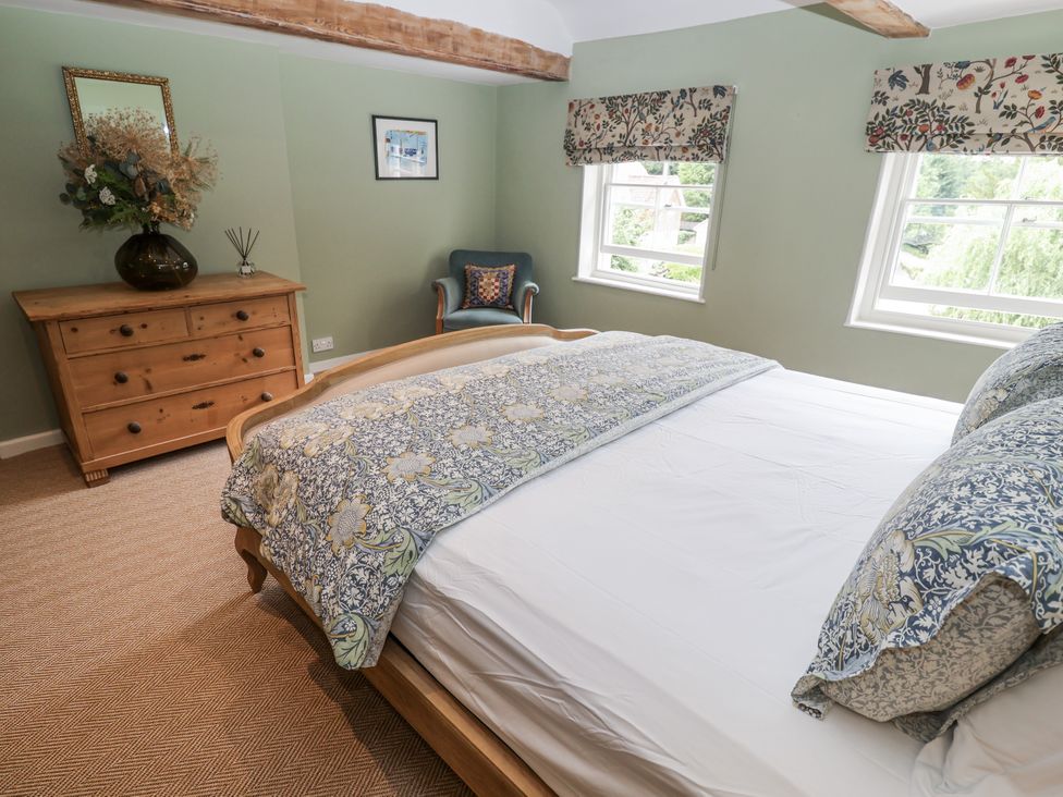 A bedroom with a bed and dresser at Syleham House Syleham near Eye
