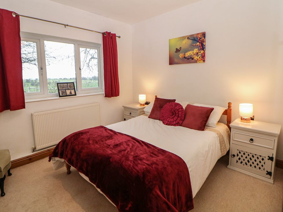 A bedroom with a bed and bedside tables at The Beeches in Aldwark near Winster