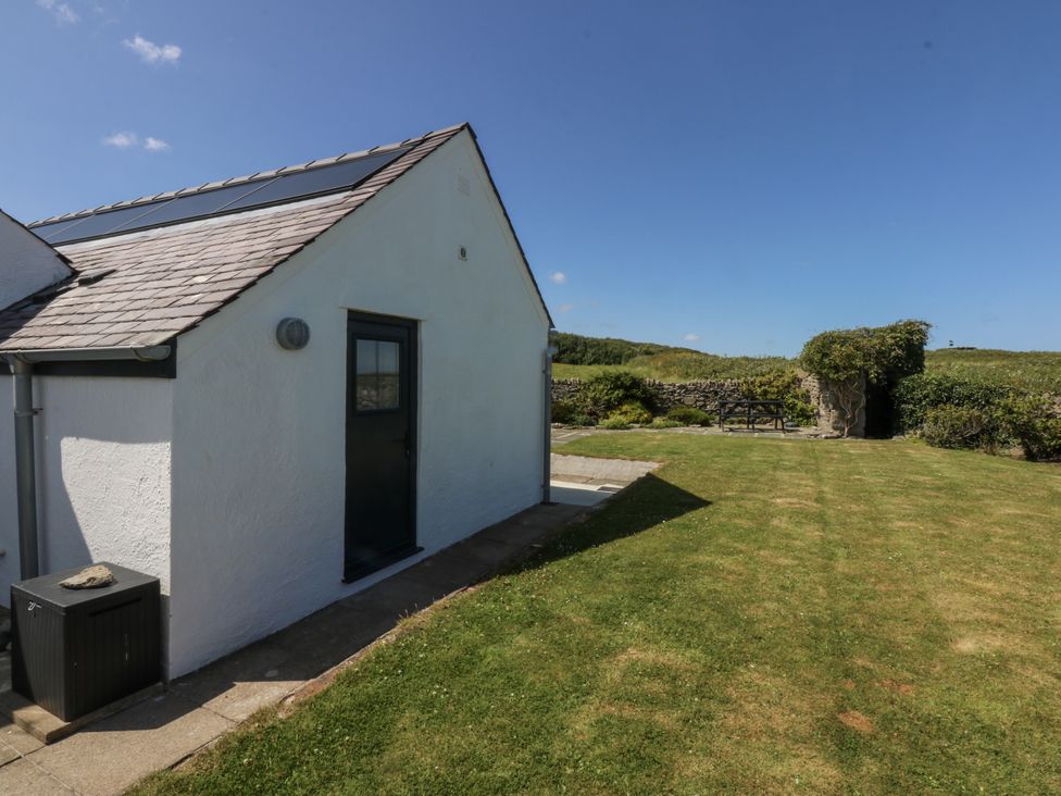 A house exterior with a door and a window at Bwthyn Y Swnt Moelfre