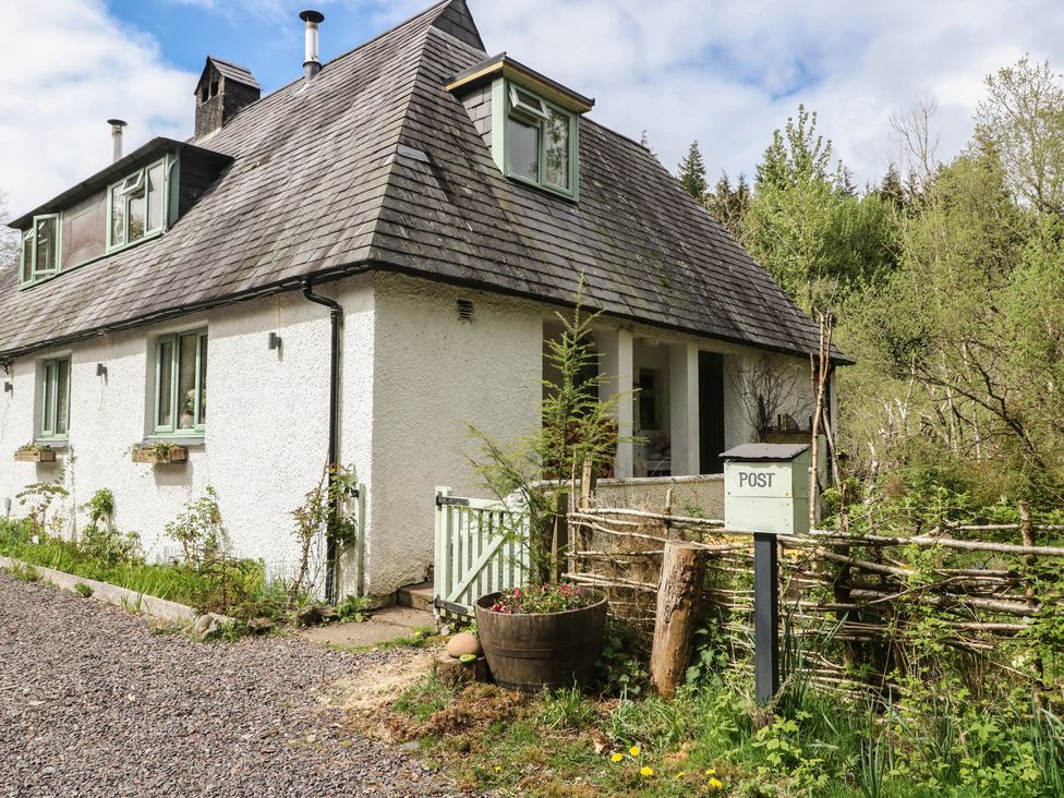 A house with a garden and post box at The Cottage In The Woods, Connel, Argyll & Bute
