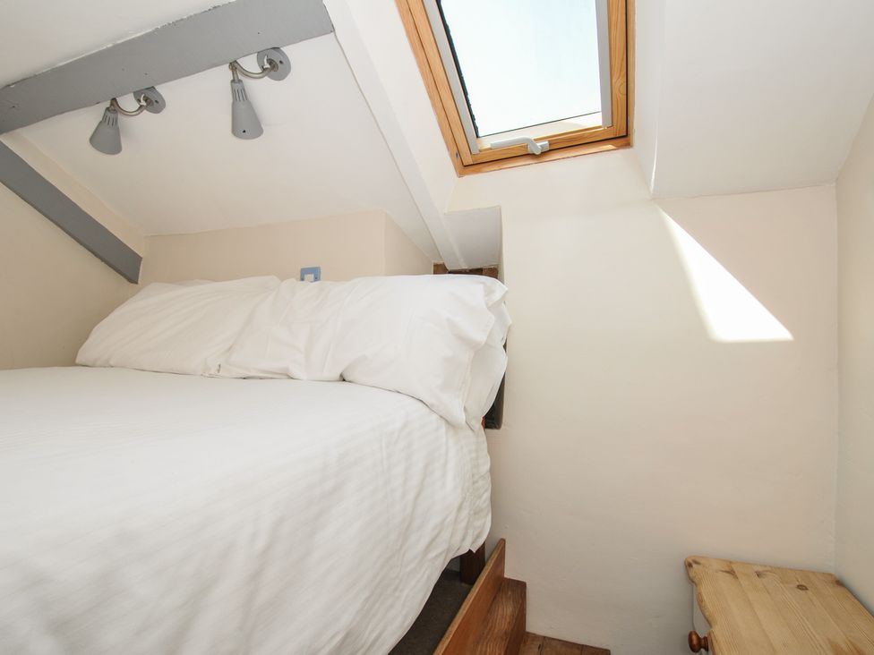 A bedroom with a bed and skylight at Little Coombe Trehunist near Liskeard