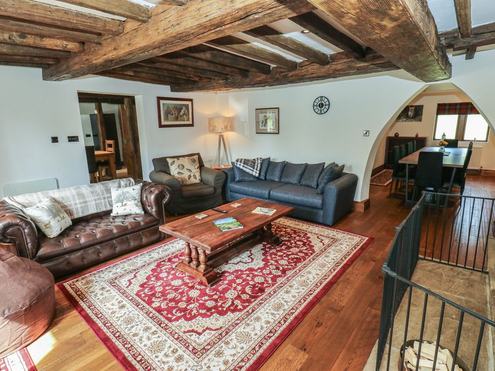 A living room with sofas and a coffee table at Stagwood House in New Mill