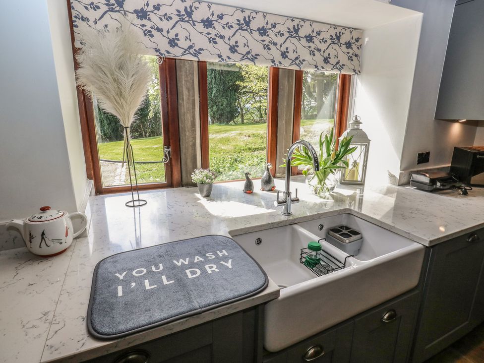 A kitchen with a sink and window at Stagwood House New Mill