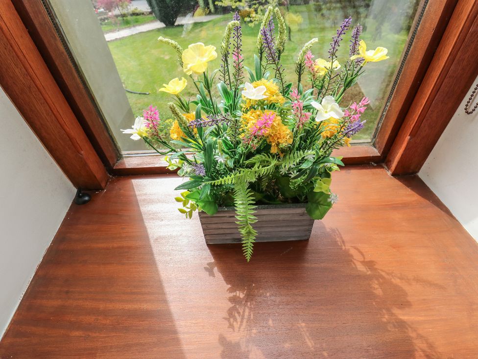 A flower arrangement on a window sill at Stagwood House in New Mill