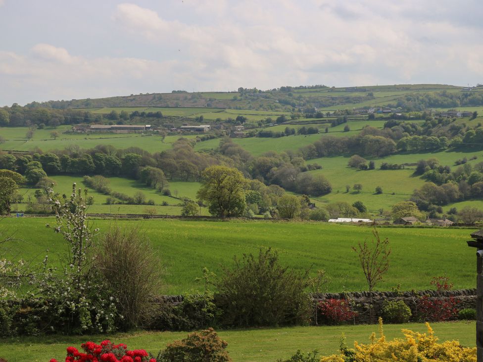 A view of green fields and hills at Stagwood House in New Mill