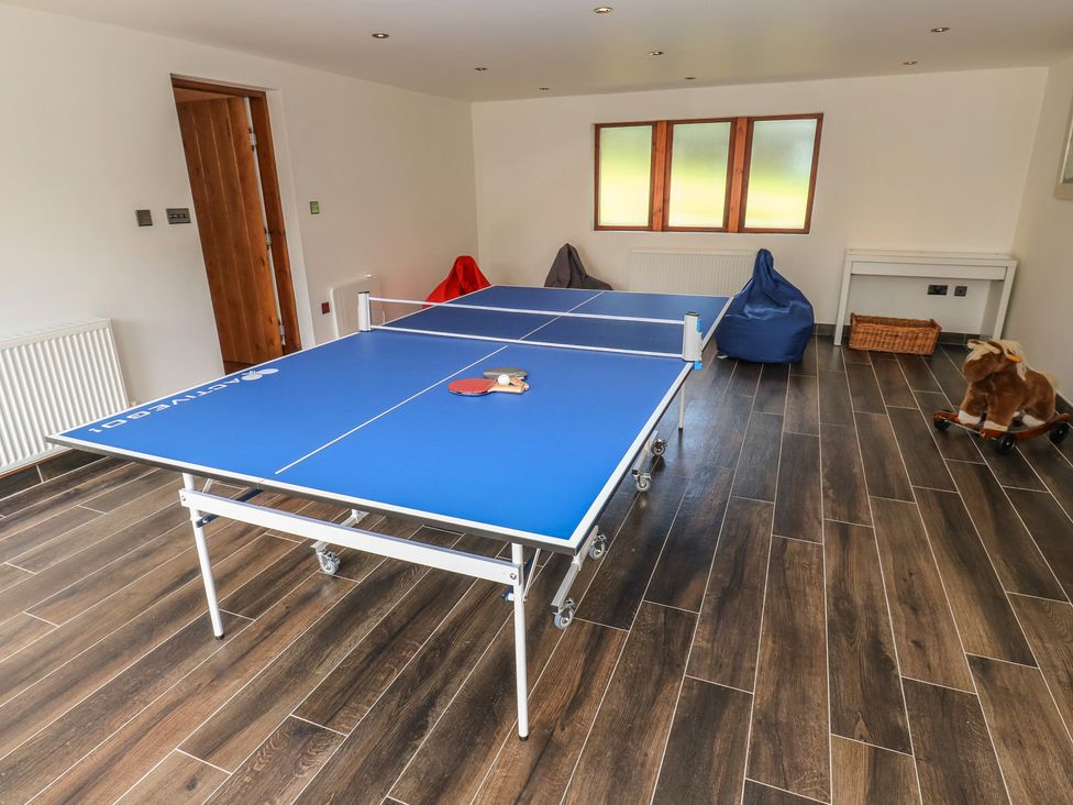A games room with a table tennis table at Stagwood House New Mill