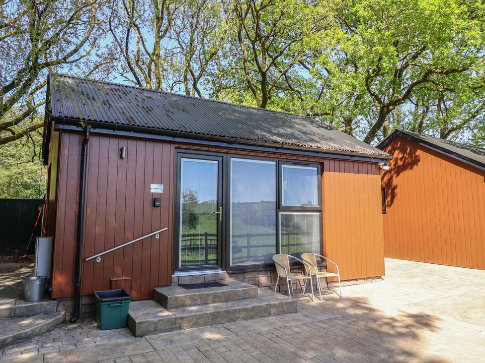 A cabin with a front door and steps at Jasmine in Bydown near Barnstaple