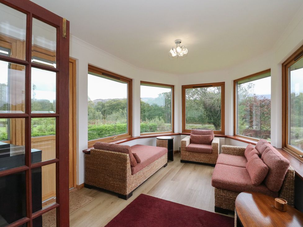 A snug with seating around a coffee table at Maybank in Muirshearlich