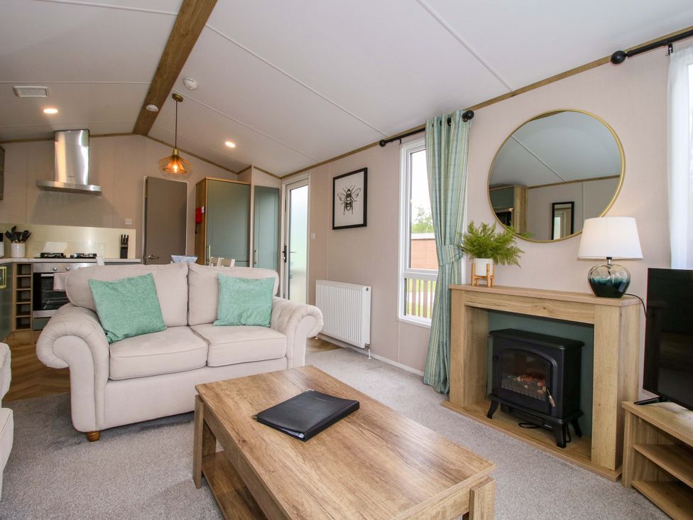 A living room with a sofa and coffee table at Owl in Shobdon