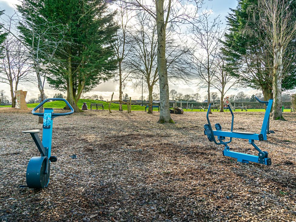 Exercise equipment and trees in a park at Owl in Shobdon