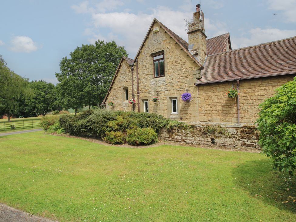 A house with a garden and pathway at Keepers Cottage in Shobdon