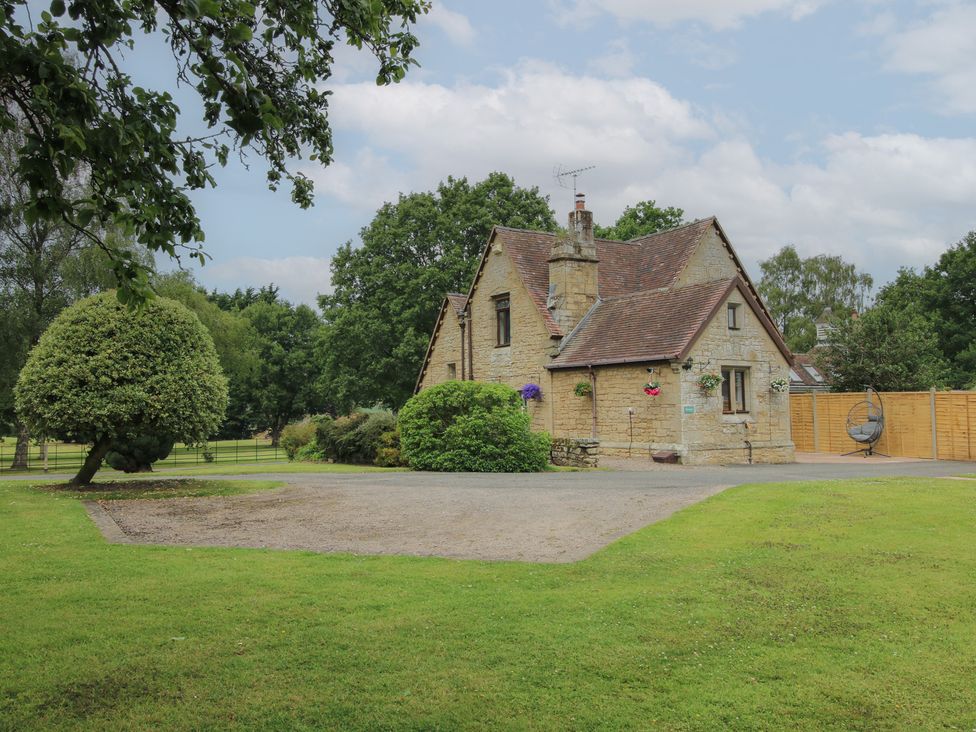 A house with trees and a garden at Keepers Cottage in Shobdon