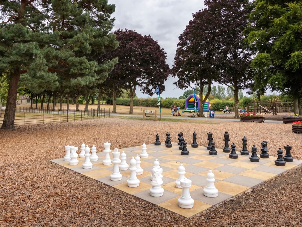 A chess board with large pieces in a park at Keepers Cottage in Shobdon