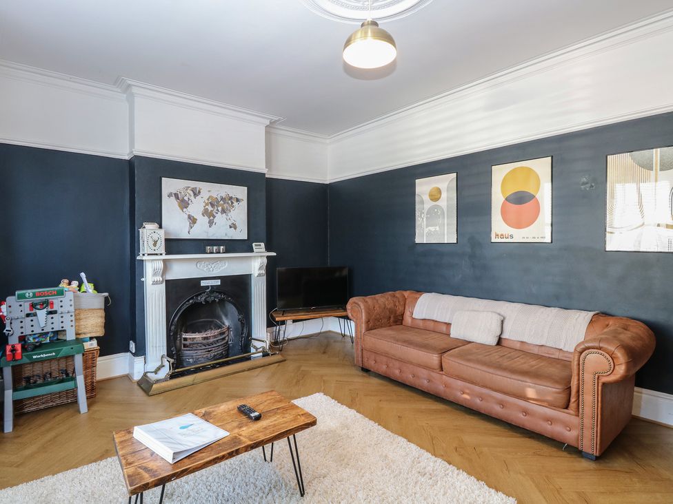 A living room with a sofa and coffee table at Sunrise House Pakefield near Lowestoft