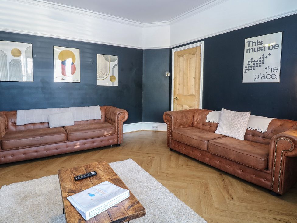 A living room with two sofas and a coffee table at Sunrise House Pakefield near Lowestoft