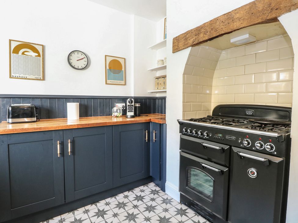 A kitchen with a countertop and oven at Sunrise House in Pakefield near Lowestoft